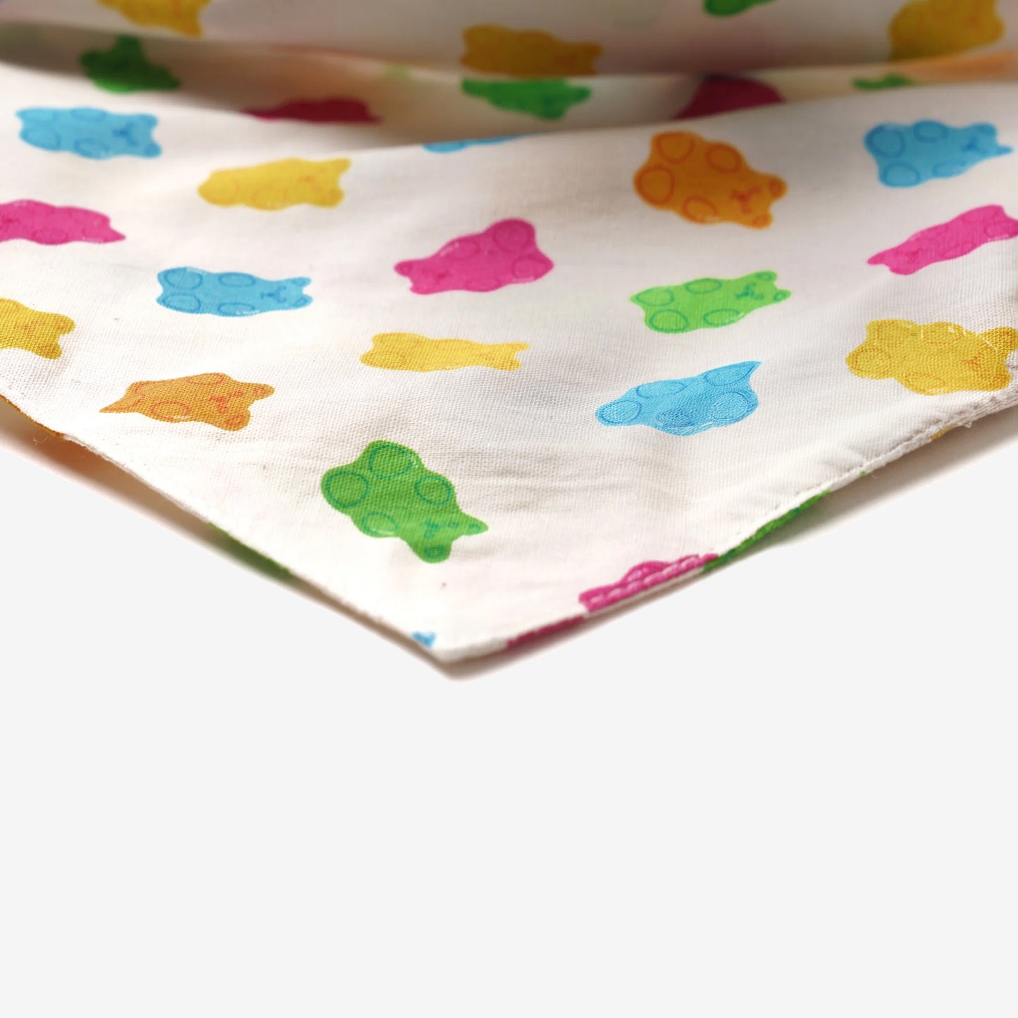 Dog bandana with multi coloured gum bears on a cream cotton fabric