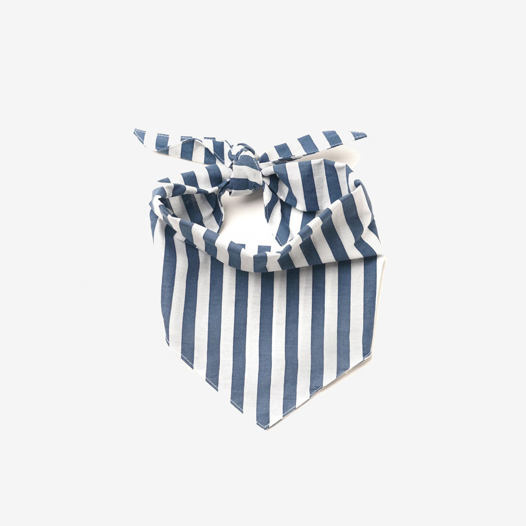 A 100% cotton navy blue and white striped dog bandana