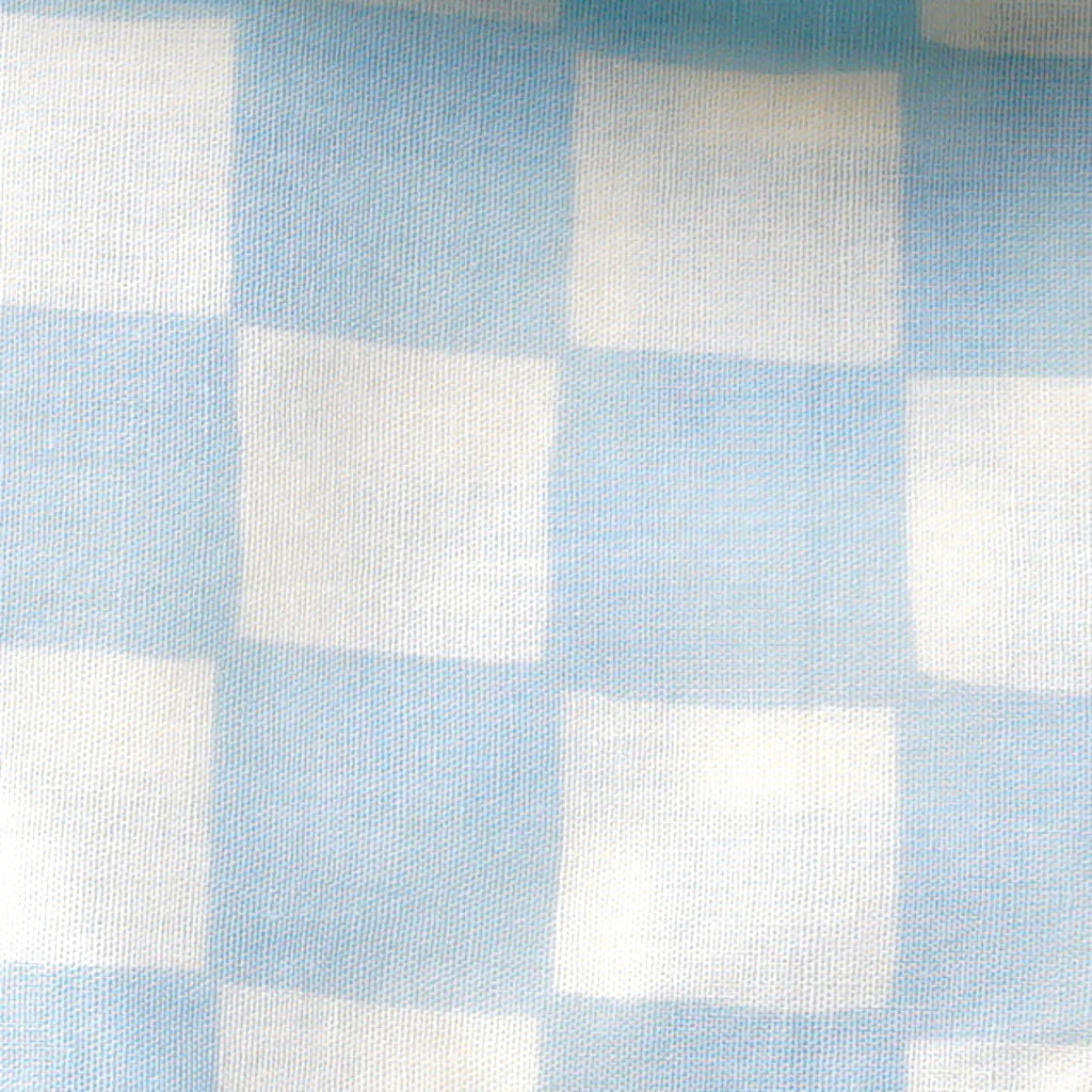 fabric detail of a 100% cotton dog bandana with a checkered pattern in pale blue and white