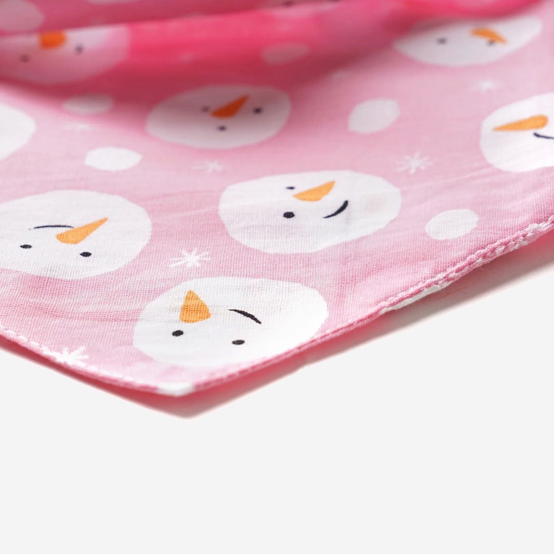 100% cotton dog bandana with patterned with snowmen faces on pink fabric