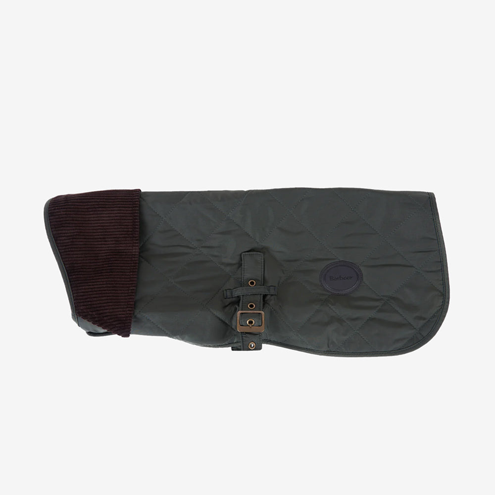 Dark green quilted dog coat with a ribbed brown corduroy collar and adjustable buckle, featuring a Barbour logo badge.