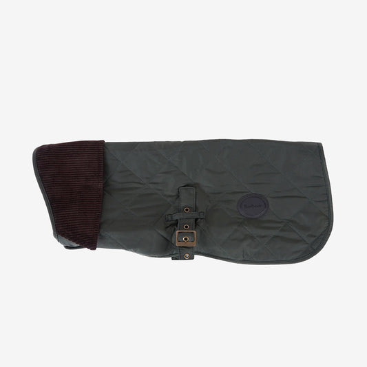 Dark green quilted dog coat with a ribbed brown corduroy collar and adjustable buckle, featuring a Barbour logo badge.