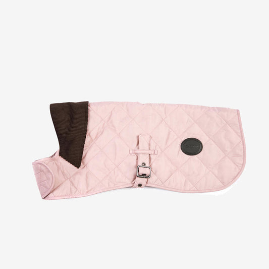 A light pink quilted pet coat with a brown corduroy collar, featuring a side buckle and a round brand patch.