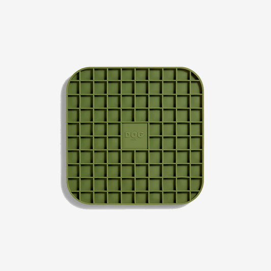 A khaki green coloured square lickimat with rounded edges and gridded squared inner pockets 