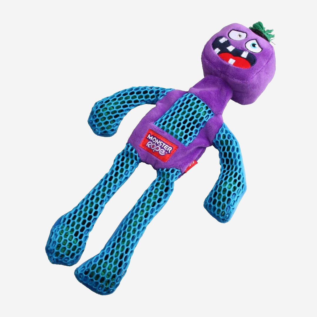 A overhead three quarter of a purple monster rope dog toy with green rope for hair, arms and legs.