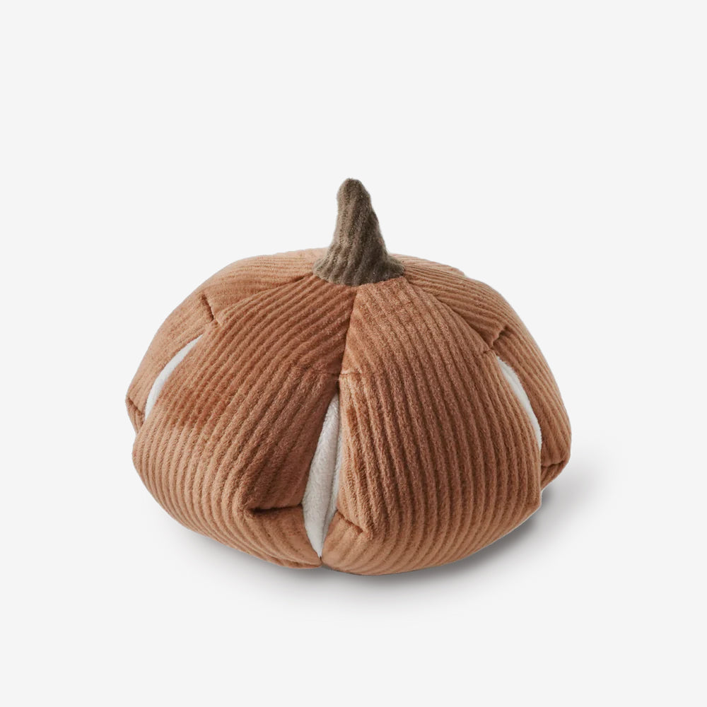 Rust coloured pumpkin snuffle enrichment toy with cream pockets.