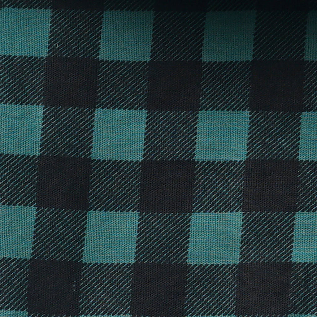 Fabric detail of a plaid checkered dog bandana in green and black