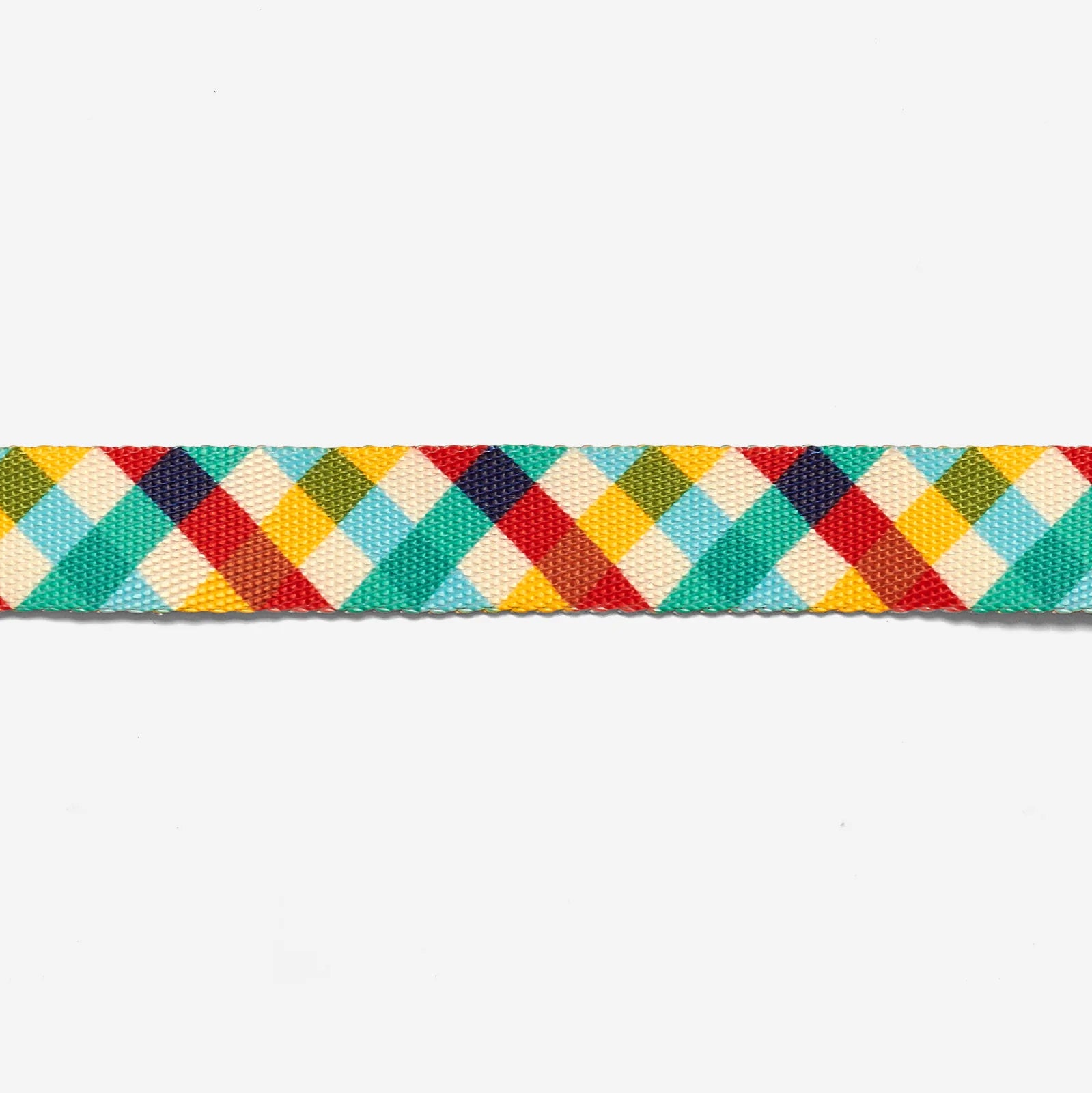 Colourful woven dog lead fabric detail, featuring a diamond pattern in teal, red, yellow, and cream on a white background.
